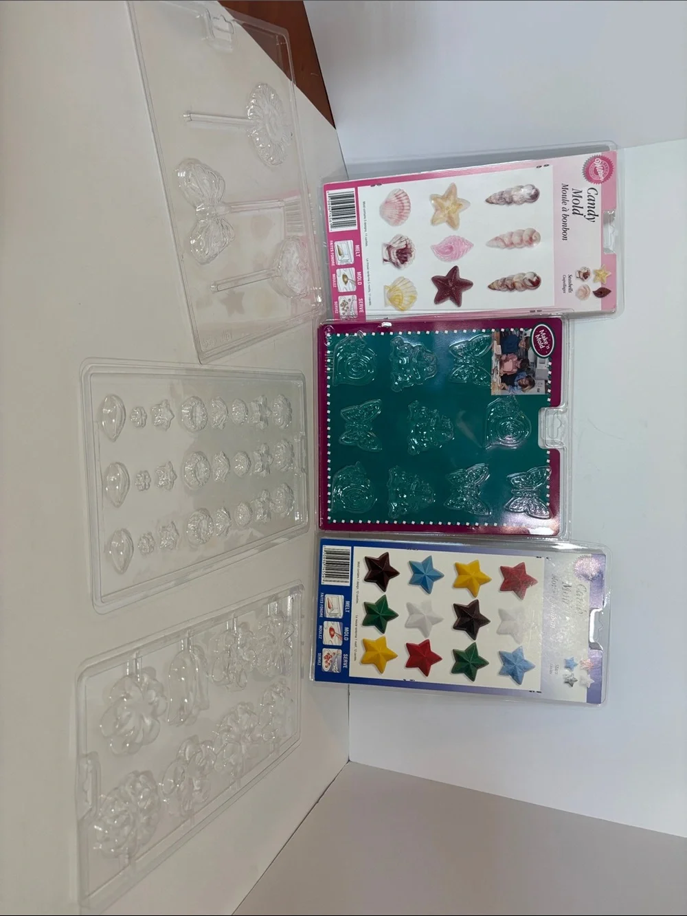 Wilton Clear Candy Mold Set with stars, shells, flowers.